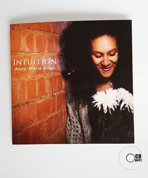 Anne Marie Allen - Card Sleeve 19 Album cover featuring a woman with curly hair holding white flowers, standing beside a brick wall. Text reads "INTUITION Anne-Marie Allen." A CD Unity logo in the corner celebrates talented artists and quality CD duplication.