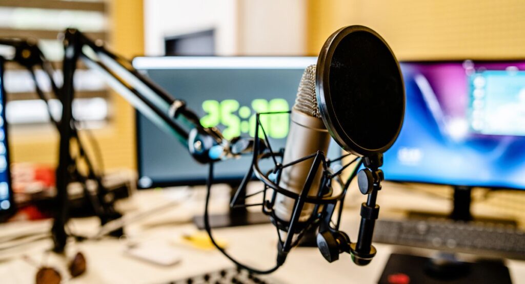 radio station setup with microphone and monitors