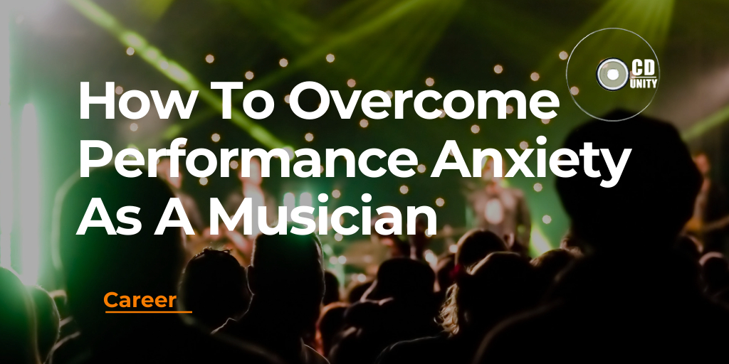 How To Overcome Performance Anxiety As A Musician 1 A crowd watches a live music performance on stage with text overlay: "How To Overcome Performance Anxiety As A Musician.