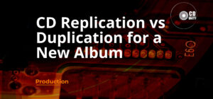 CD Duplication, Replication and Print Wolverhampton 33 Text reads “CD Replication vs Duplication for a New Album” over a close-up of an electronic circuit board, with a logo and the word “Production” in the lower left corner.